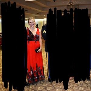 Red ball gown with black floral detail. Size 8